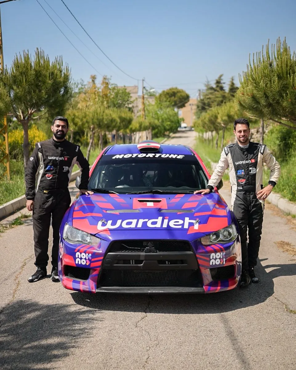 Carl Rizk and his co-driver with the rally car