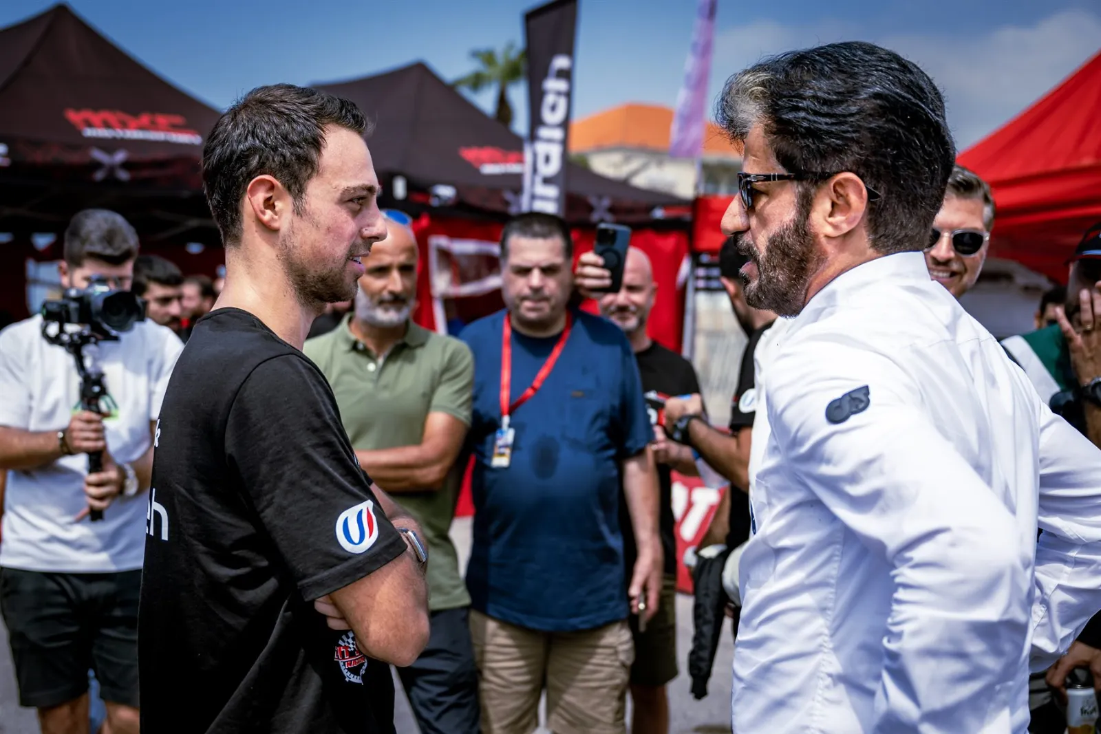 Carl Rizk talking with FIA President Mohammed Ben Sulayem