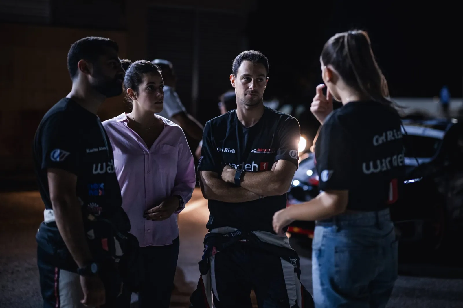Carl Rizk with the team before a night stage